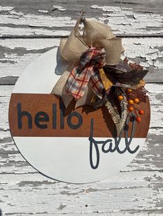 a sign that says hello fall on it