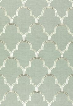 an image of a blue wallpaper with white circles and arches on the back ground