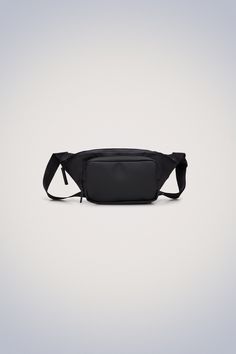 a black fanny bag on a white background with an empty space in the bottom left corner