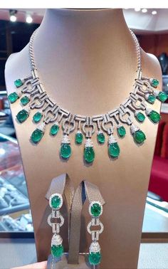 An exceptional Art Deco style parure, complete with earrings and necklace, so stunning and refined , a very piece of art. Necklace come in 18k gold with natural emeralds from Zambia, fine quality, in cabochon cut of 76,40 carats, and 641 pieces of natural diamonds of 8,68 carats, F color and VS clarity. Earrings come in 18k gold with 4 pieces of natural emeralds from Zambia, fine quality, of 19,93 carats, and 142 pieces of natural diamonds of 2,95 carats, round brilliant cut, F color and VS clar Dazzling Jeweled Emerald Necklace For Formal Events, Exquisite Pear-shaped Emerald Necklace For Formal Occasions, Luxury Emerald Necklace With Jewels For Formal Occasions, Luxury Emerald Necklace With Jewels For Formal Events, Luxury Emerald Necklace For Formal Events, Exquisite Diamond And Emerald Formal Necklace, Exquisite Diamond Emerald Necklace For Formal Occasions, Exquisite Emerald Necklace With Diamonds For Formal Events, Formal White Gold Emerald Necklace With Jewels