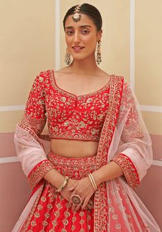 Capture the essence of eternal beauty with this Red Silk Embroidered Bridal Lehenga. Crafted from luxurious raw silk, it features intricate zardozi embellishments that combine silken threads, dabka, cutdana, and sequins. The meticulously embroidered blouse and matching double dupatta in red and blush pink hues complete this enchanting ensemble. Perfect for a bride looking for a timeless and captivating wedding dress. Composition : Lehenga and Blouse - Raw Silk, Dupatta - Soft Net Care: Dry Clean Double Dupatta, Red Lengha, Red Bridal Lehenga, Embroidered Bridal Lehenga, Lehenga And Blouse, Eternal Beauty, Indian Wedding Wear, Parsons School Of Design, Wear Red