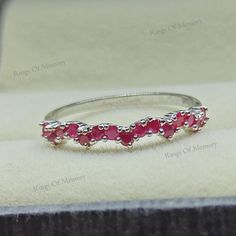 Natural Ruby Ring, Vintage Ruby Band, Ruby Wedding Band, Dainty Ruby Ring, Sterling Silver Ring, July Birthstone Ring, Matching Band Ring -------------------------------------------------------------------------------------------------------------------------------------------------------------------------------------------------------------- Ruby Wedding Band * Metal : 925 Sterling Silver  * Gemstone  Stone : Ruby * Shape  : Round  * Size : 1.8mm * Weight : 1.86 Ct ( Approx. )   * Clarity : Eye Clean * Personalization : Possible * Occasion : Party , Anniversary , Wedding Sent in a very elegant wedding ring box, ready for one special lady. Customization is always welcome and please feel free to contact with me if you have any design ideas! Thank You....:) Ruby Round Band Wedding Jewelry, White Gold Ruby Ring With Accent Stones For Wedding, Stackable Round Ruby Ring For Wedding, Silver Ruby Half Eternity Promise Ring, Stackable Crystal Ring For Wedding With Round Band, Stackable Crystal Wedding Ring With Round Band, Adjustable Ruby Wedding Ring, Adjustable Ruby Rings For Wedding, Ruby Eternity Band With Prong Setting For Wedding