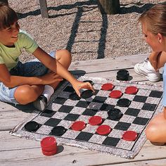 two children playing checkers on a picnic table with the text poshmark $ 13