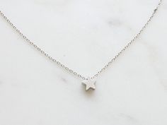 Silver Star Print Necklace, Silver Necklace With Star Print For Gift, Silver Star Print Necklace For Gift, Silver Star Print Necklace Perfect For Gift, Tiny Star Minimalist Necklaces, Minimalist Tiny Star Necklaces, Tiny Star Shaped Minimalist Necklaces, Minimalist Star Necklace For Everyday, Minimalist Star Charm Necklace With Delicate Chain