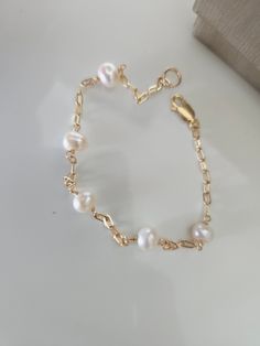 Gold-filled fresh water pearl bracelet. Your choice of lustrous white, pink, chocolate or blue pearls. Pearls are 6 to 7mm. Fresh Water Pearl Bracelet, Pearl Bracelet Gold, Blue Pearls, Pearls Bracelet, White Pearl Bracelet, Pink Chocolate, Freshwater Pearl Bracelet, Fresh Water Pearl, Blue Pearl