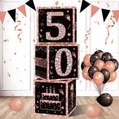 a black and pink 50th birthday card with balloons, streamers and confetti