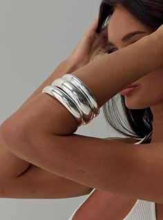 Silver-toned bangle pack Pack of three, fixed shape Princess Polly Lower Impact 100% reclaimed steel Chunky Silver Jewellery, Womens Silver Jewelry, Silver Jewelry Box, Silver Bracelets For Women, Chunky Jewelry, Jewelry Lookbook, Sterling Silver Bangles, Silver Bangle, Gorgeous Bracelet