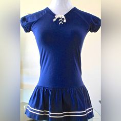 New “Sailor-Frescu Blue” Girls Short Sleeve Dress Ralph Lauren Size 5 Navy With White Cord Draw String At Neck With 2 White Stripes On Ruffle Bottom Navy Embroidered Polo Upper Left 100 % Cotton Pit To Pit 13 Inch Spring Sailor-style Short Sleeve Dresses, Sailor Style Short Sleeve Fitted Dress, Fitted Sailor Dress With Short Sleeves, Summer School Uniform Dress With Short Sleeves, Summer Short Sleeve School Uniform Dress, Navy Sailor Style Top For Spring, Navy Sailor Tops For Spring, Blue Sailor Cotton Dress, Blue Sailor Style Cotton Dress