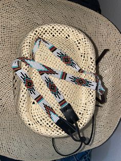 "1/4\" wide aztec hatband .All bead work is beaded with 10lb extreme braided nylon line.  All hat bands are finished at 23\" with glued than sewed down leather ends and an adjustable leather tie.  These hatbands make the perfect edgy new accessory while at work or while horseback riding. Made in Montana. Would make the perfect gift. Ready to ship!" Western Braided Hat Band For Ranch, Adjustable Braided Hat Bands For Rodeo, Adjustable Multicolor Ranch Hats, Traditional Adjustable Hat Bands For Rodeo, Adjustable Beaded Hat Bands For Country Events, Western Braided Hat Band For Festivals, Adjustable Beaded Hat Band For Festivals, Adjustable Braided Bohemian Hat Bands, Adjustable Southwestern Multicolor Hat Bands