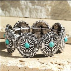 This Unique Navajo Natural Stone And Metal Concho Stretch Bracelets Are Super Cute And A Great Addition To Your Wardrobe. Love Thesezinc Composite Stone, Nickle/Lead Compliant Approximate Length 8" Diameter 2" Imported Nickel-free Turquoise Beaded Bracelets For Festivals, Southwestern Style Silver Jewelry For The Beach, Bohemian Blue Metal Bracelets, Bohemian Blue Metal Bracelet, Blue Bohemian Metal Bracelets, Bohemian Stretch Bracelet For Beach, Bohemian Turquoise Stretch Bracelet For Festivals, Bohemian Round Stretch Bracelet For Beach, Bohemian Adjustable Concho Bracelets