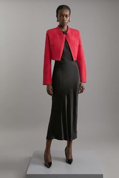 Increase The Formality In Our Cropped Jacket, Which Features A Full-Coverage High Neckline To Protect From The Elements, As Well As A Classic Collar And A Slightly Cropped Length. Style It With Tailored Trousers And Pointed Toe Heels For A Statement Occasion Look, Perfect For An Alternative Wedding Guest Outfit, Or For Unique Office Wear. Cropped Tailored High Neck Jacket Formal High Neckline And Collar Comfortable, Relaxed Fit Cropped Length Relaxed, Open Design