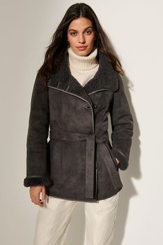 Designed for ultimate insulation and maximum eye appeal, the Lillian sheepskin coat will complement almost anything in your wardrobe. Its generous, plush collar easily folds up to caress the neck in irresistible curly lamb, and its convenient, detachable belt helps create a flattering, cold-weather-blocking fit. Elegant Sheepskin Outerwear For Work, Casual Long Sleeve Sheepskin Outerwear, Elegant Shearling Outerwear For Cold Weather, Elegant Shearling Outerwear, Elegant Shearling Fur Coat For Cold Weather, Hooded Sheepskin Winter Outerwear, Sheepskin Long Sleeve Outerwear With Zipper, Brown Sheepskin Outerwear With Pockets, Chic Long-sleeve Sheepskin Leather Jacket