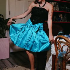 This Vintage Deadstock Marshall Fields Party Dress From The 80s Makes A Big Statement. Boasting A Teal Bottom And A Black Sequin Bodice, It's Sure To Turn Heads. Perfect For Your Holiday Festivities And Never Worn, This One-Of-A-Kind Piece Is A Must-Have! *Size: 30 Bust , 32 Waist Material: 55% Acetate ,30% Polyester, Skirt - 100% Acetate 80s Prom Dress Ideas, 80's Prom Theme Party Outfits, Vintage 80s Clothes, Retro Holiday Party Dresses, 80s Bridesmaid Dress, 80 Prom Dresses 1980s, Early 2000s Prom Dress, 80’s Prom Dress, 80s Dresses Party