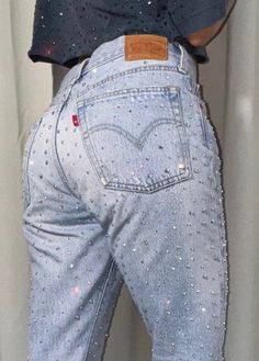 Vintage Levi 501 denim jeans - remade by us with high quality AB crystal rhinestones These jeans are very rare because there's only 10% of Levi jeans that has a red tab without letters! The model is normally a size EU34 | US25/26, so this would be a size EU36/38 US27/28. Please check the measurements. Waist: 75 cm Hip: 94 cm Length: 100cm Jeans condition: 9/10 Please note that due to the handmade nature of our creations, some items may have minor imperfections. Vintage items may have signs of wear. Any noticeable flaws will be clearly communicated in the item description. *We don't accept returns or cancellations, please make sure you carefully read the description before purchasing. Medium Wash Rhinestone Denim Jeans, Bedazzled Jeans Outfits, Fitted Straight Leg Jeans With Rhinestones, Fitted Straight Leg Rhinestone Jeans, Blue Rhinestone Straight Leg Jeans, Bedazzle Jeans, Diy Rhinestone Jeans, Glitter Jeans Outfit, Rhinestone Jeans Outfit