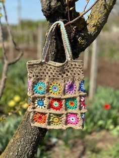 Shoulder crochet bag the granny square is a great gift for a child, teenager or adult lover. It is absolutely soft, cute and comfortable. The hat is crocheted from cotton, so it is suitable for a hot summer day for both a child and an adult. A handbag will definitely attract the attention of others and lift your spirits. This can be a phone case, you can also put a wallet, mirror, cosmetics, sunglasses or other small items in it. Comfortable to wear on the shoulder. Bag size: 10 x 9 x 2.2 inches Crochet Grandma Square, Crochet Grandma, Gift Box For Her, Baby Soap, Crochet Handbag, Flower Bag, Unique Bags, Crochet Handbags, Large Bag