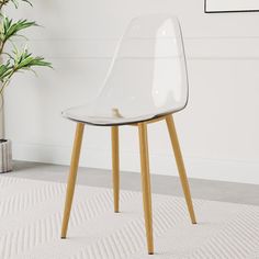 a clear chair sitting on top of a white rug next to a potted plant