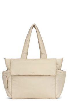 a white handbag with two pockets on the front and one pocket in the back