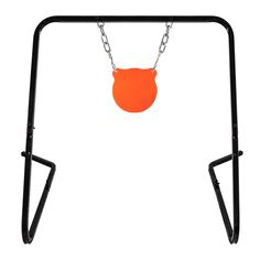 an orange ball is hanging from a black metal swing set with chains on each side