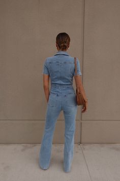 Introducing our Chelsey Denim Jumpsuit, a versatile and stylish addition to your wardrobe. Blue Stretch Denim Jumpsuit With Short Sleeves, Fitted Denim Blue Jumpsuit With Pockets, Chic Non-stretch Denim Overalls, Stretch Denim Jumpsuit In Denim Blue, Stretch Denim Blue Denim Jumpsuit, Stretch Denim Blue Overalls, Stretch Denim Blue Jumpsuit Overall, Blue Stretch Denim Overall Jumpsuit, Chic Blue Denim Overall Jumpsuit