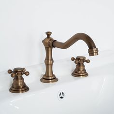 two faucets are shown in this bathroom sink