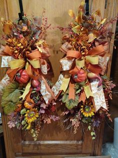 two wreaths with autumn decorations on them