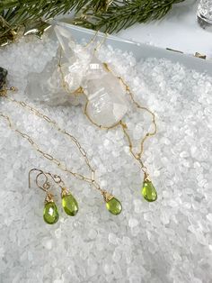 🌴 VACATION ALERT 🌴 I will be on vacation from 8/8-8/23. If you place an order after 8/5, it WILL NOT SHIP UNTIL 8/25.Beautiful faceted Peridot Briolettes are hand wrapped in the pretty matching set.Necklace measures 18".Bracelet measure 7" & can be shortened on any of the links.Earrings dangle from gold filled ear wires & include silicon ear backs.Beautiful set for those August Birthdays, lovers of Green, or St. Patrick's Day! Peridot Faceted Jewelry For May Birthstone, Faceted Peridot Jewelry For May Birthstone, Faceted Briolette 14k Gold Filled Jewelry, Gold Peridot Jewelry For May Birthstone, Gold Peridot Jewelry With Gemstone, Gold Peridot Gemstone Jewelry, Dangle Peridot Jewelry For Gifts, Peridot Dangle Jewelry For Gift, Peridot Dangle Jewelry As A Gift