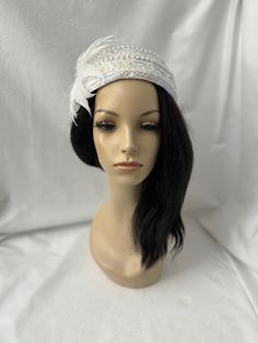 This is a vintage inspired Juliet cap style 1950s - 1960s white iridescent sequin fascinator half hat with a feather  flower ideal for wedding, bridal tea party, mother of the bride, COGIC church hat or any other formal special occasion. Lightweight Design to  be worn either side  Alligator clips underneath or elastic band Easy to wear Can be worn tilted on either side towards the face, as a Fascinator hat. Vintage style in the center of head.  Approx: 15" side by side and 7.5" back and front. Flapper Style Fascinator For Kentucky Derby Evening, Flapper Style Evening Fascinator For Kentucky Derby, Fitted Headband Fascinator For Vintage Events, Gatsby Style Fitted Cloche Hat For Wedding, White High Crown Fascinator For Evening, Gatsby Style Wedding Headband Hat, White Fitted Vintage Top Hat, Flapper Style Fascinator For Vintage Events, Flapper Hat Headpiece For Party