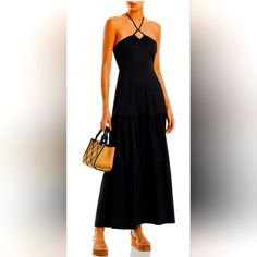 Sleeveless Halter Straps Tie At Back Neck Seamed Waist Tiered Skirt Smocked Panel At Back Waist Back Zip Closure Lined Material & Care 100% Cotton; Lining: 100% Polyester Hand Wash Casual Black Halter Maxi Dress, Black Casual Halter Maxi Dress, Casual Black Maxi Halter Dress, Fitted Black Halter Dress For Summer, Black Fitted Halter Dress For Day Out, Casual Black Halter Dress For Vacation, Sleeveless Black Halter Dress For Day Out, Black Sleeveless Halter Dress For Day Out, Elegant Black Halter Dress For Day Out