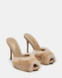 DREAMY + DELICATE + CHARMING The PRIYA sandal pairs a slender stiletto heel with a retro-inspired peep toe design on the slide strap at the front. Stiletto peep toe slide sandal Slip-on style 4.25 inch heel height Faux fur upper material Microsuede lining Leather sock Synthetic sole Imported Tennis Shoe Heels, Faux Fur Heels, Fuzzy Heels, Tan Mules, Fur Heels, Leather Socks, Women's Heels, Fur Boots, Sneaker Heels