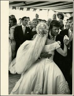 an old photo of a bride and groom walking down the aisle at their wedding ceremony