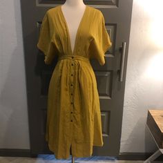 Plunging V-Neck With Button-Up Midi. Color Is A Beautiful Mustard Gold. Fabric Is Opaque, Drapes Beautifully, And Is Light Enough For A Hot Summer. Basically New Without Tags (Worn Twice) Reposhing This Item I Purchased From @Heft6129. Loved It, But Ready To Rotate For Something New. Questions? Leave A Comment Below! Summer V-neck Shirt Dress With Buttons, V-neck Maxi Dress With Button Closure For Daywear, Fitted V-neck Shirt Dress For The Beach, V-neck Maxi Dress With Buttons For Date Night, V-neck Mini Dress With Button Closure For Date Night, Spring V-neck Midi Dress With Buttons, V-neck Midi Dress With Button Closure For Vacation, V-neck Shirt Dress For Summer Day Out, Summer V-neck Midi Dress For Daywear