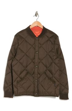 Add a versatile staple to your collection with this quilted jacket that is reversible. Model stats: 6'1" height, 32" waist. Model is wearing size M. 27.5" length (size M) Stand collar Long sleeves Button front Dual pockets Ribbed cuffs All-over quilting Woven Otter shell: 100% nylon; inner shell: 100% nylon; filling: 100% sorona polyester; knit: 98% polyester, 2% spandex Machine wash cold, tumble dry low Imported Calvin Klein Casual Outerwear With Button Closure, Reversible Long Sleeve Outerwear For Cold Weather, Fall Nylon Quilted Jacket With Fleece Lining, Casual Calvin Klein Outerwear With Button Closure, Calvin Klein Brown Outerwear For Fall, Calvin Klein Outdoor Fall Outerwear, Fall Quilted Nylon Jacket With Fleece Lining, Fall Nylon Quilted Jacket, Calvin Klein Long Sleeve Puffer Jacket For Fall