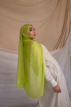 Bring some vibrancy to your wardrobe with the playful Lemon Grass hijab. Crafted in our cooling woven fabric, it feels like a soft summer breeze, perfect for warm weather. This lively green hue adds a touch of freshness and joy to any outfit, making it an essential piece for the sunny season. Shop the Lemon Grass hijab online and refresh your collection with this must-have accessory. Green Summer Beach Scarves, Grass Outfit, Sunny Season, Instant Hijab, Soft Summer, Outfit Making, Summer Breeze, Green Grass, Lemon Grass