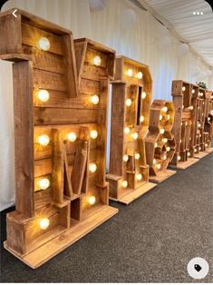 several wooden letters with lights on them