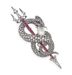 Handmade Brooch Recycling: No Silver weight: 22.000 Grams Brooch Length: 3.00 inches Brooch width: 2.00 inches Gemstone: Rose cut diamonds, Ruby & Pearl Natural Diamond Diamond weight: 4.88 ct Diamond colure: Light tinted Brown Diamond shape: Round Ruby weight: 0.89 ct Pearl weight: 3.56 ct Ruby & Pearl: Lab created Stone putting: prongs & Pave Material: Silver Silver purity : 925 Brooch Finished: Oxidized Black & Gold plated Sea Monster, Snake Jewelry, Diamond Brooch, Natural Pearl, Brown Diamond, Victorian Jewelry, Van Cleef Arpels, Pearl Diamond, Animal Decor