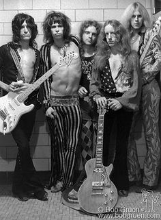 an old black and white photo of the band aerooboxs with their guitars