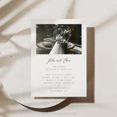 a wedding card with an image of a bride and groom on the front, in black and white