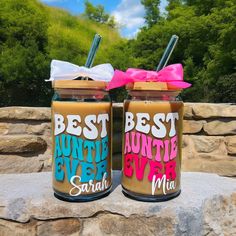 two mason jars with the words best and minute ever written on them are sitting next to each other