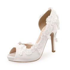 Step into summertime elegance with our collection of Women's White Wedding Shoes. Designed to complement the blissful ambiance of a summer wedding, these shoes blend sophistication with comfort. Crafted with premium materials, they ensure a perfect fit for your special day. Whether you prefer strappy sandals, chic pumps, or graceful flats, our selection offers a variety of styles to suit your taste. Radiate timeless charm as you walk down the aisle in our Women's White Wedding Shoes, the epitome