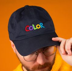 "Flashback to the 2nd grade with this beautifully embroidered Nintendo Gameboy Color inspired design. * 100% chino cotton twill * Unstructured, 6-panel, low-profile * 3 ⅛\" crown * Adjustable strap with antique buckle * Head circumference: 20 ½\" - 21 ⅝\"" Multicolor Cotton Hat For Streetwear, Cotton Dad Hat With Embroidered Patch, Multicolor Snapback Baseball Cap In Cotton, Cotton Dad Hat With Letter Embroidery And Flat Bill, Multicolor Cotton Snapback Baseball Cap, Custom Embroidered Cotton Dad Hat, Casual Cotton Baseball Cap With Custom Embroidery, Cotton Dad Hat With Embroidered Text, Blue Embroidered Cotton Dad Hat