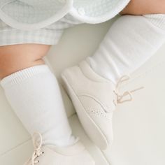 Baby boy wearing the Boys White Knee Socks made from cotton/nylon and spandex. Classic Fitted Knee-high Socks, Classic White Stretch Socks, Classic Stretch Knee-high Socks, Classic Knee-high Socks, Classic Fitted Beige Socks, Classic Fitted Cotton Socks, Classic White Knee-high Socks, Comfortable White Cotton Knee-high Socks, Knee High Socks Toddler