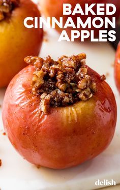 baked cinnamon apple halves on a cutting board with text overlay that reads baked cinnamon apples