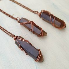 "Raw smokey lemurian quartz point necklace. Crystal wire wrap crystal pendant, heal crystal necklace. Wire wrap jewelry. These necklaces are stunning with a unique color and wrapping to each individual pendant. Each one is unique. Chain length choice of 14\", 16\", 18\", 20\", 24\". These necklace can be worn with others. Smokey Quartz is an excellent grounding stone. It gently neutralises negative vibrations and is detoxifying on all levels, prompting elimination of the digestive system and pro Copper Wire Wrapped Crystal Necklace For Healing, Healing Copper Wire Wrapped Crystal Necklace, Wire Wrapped Crystal Pendant Necklace For Jewelry Making, Brown Wire Wrapped Crystal Necklace For Gift, Crystal Spells, Crystal Wire Wrap, Wire Wrapped Crystal Pendant, Lemurian Quartz, Earthy Jewelry