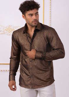 Limited edition- One of a kind A modern shirt with an unexpected edge. This brown metallic brocade shirt from Mondo is embellished with shine texture fabric detailed. Looking sharp Your style status can’t be messed with, and this shirt from Mondo makes that clear. A new and versatile wardrobe staple, great for under the blazer for dinner, party and special occasion night A tailored, modern cut and cotton fabric makes for a flattering shirt. Paired with a coordinating pant you'll have an elevated Brocade Shirt, Texture Fabric, Versatile Wardrobe, Custom Buttons, Dinner Party, Wardrobe Staples, Nice Dresses, Special Occasion, Long Sleeve Shirts