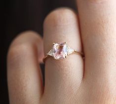 Blush Sapphire Engagement Ring Radiant Peach Pink sapphire 1.95ct Diamond Ring Set in Yellow Gold Trillion diamond Ring by Minimalvs | Capucinne Jewelry Trillion Diamond Ring, Princess Wedding Rings, Engagement Ring Radiant, Peach Sapphire Rings, Trillion Diamonds, Peach Sapphire, Chic Rings, Cushion Engagement Ring, Timeless Ring