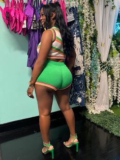 This “Eboni” set features a round neckline, sleeveless, crop top, and finished white the high waisted shorts. -100% Polyester -Stretch material Tee is wearing a medium, 155 lbs. Hand wash, cold water. Do not bleach. Trendy High Waist Crop Top For Vacation, Trendy Crop Top For Beach, Green Stretch Crop Top For Beach Season, Trendy High-waist Crop Top For Vacation, Trendy Short Crop Top For Loungewear, High Waist Crop Top For Vacation, Trendy Short Length Crop Top For Loungewear, Sporty Cropped Bottoms For Summer, Trendy Short Crop Top For Beach