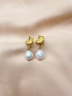 The Dasha Earrings  For pierced ears - order comes with stud earring backs + 14k Gold-plated crinkle earring + Genuine, freshwater baroque pearls ABOUT BAROQUE PEARLS Baroque pearls are some of the most fascinating organic gems available on the jewelry market. Baroque refers to all pearls that aren't perfect spheres. In other words, if it isn't perfectly round, it is considered a baroque pearl. These imperfections result in pearls of varied and irregular shapes and sizes, sometimes with uneven s Gold Pearl Drop Plug Earrings As Gift, Gold Clip-on Cluster Earrings As Gift, Gold Clip-on Cluster Earrings For Gift, Baroque Pierced Earrings As Gift, Baroque Pearl Earrings As A Gift, Single Baroque Earring As A Gift, Gold Cluster Earrings With Pearl Drop For Gift, Gold And Pearl Earrings, Jewelry Market