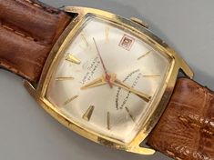 ⭐️⭐️⭐️⭐️⭐️ LORIN PIRADET MENS Vintage Watch, 21 Jewels Wind Up, Sweep Second Hand, Ships Free. Click Item Details to Read More vintage 60s gold color  w/day man hand-wind watch ✅ DIAL: A handsome white dial with golden hands and hour markers. Date window at the three. Sweep Second Hand. Dial is signed: Lorin Piradet, 21 Jewels, Unbreakable Mainspring. Shock Protected.  ✅ CASE:  Gold plated rectangular tonneau case with stainless steel back. Back is signed: Base Metal Bezel, Stainless Steel Back. Golden Hands, Man Hand, Men's Vintage Watch, Watch Dial, Mens Vintage, White Dial, Wristwatch Men, Vintage 60s, Base Metal