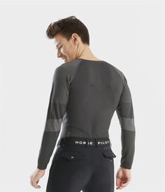 The long-sleeved Optimax T-shirt helps keep the rider's shoulders back, and provides warmth. Breathable Long Sleeve Tops For Outdoor Activities, Technical Long Sleeve Tops For Fall, Technical Winter Tops For Outdoor Activities, Functional Long Sleeve Tops For Outdoor, Functional Gray Winter Top, Gray Long Sleeve Tops For Outdoor Activities, Winter Long Sleeve T-shirt For Outdoor Activities, Sporty Long Sleeve T-shirt For Outdoor Activities, Fitted Long Sleeve Functional T-shirt