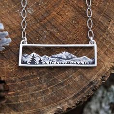 “Silver Landscape” Artwork Artsy Sun Mountainscape Mountain Ridge Bohemian Hippie Nature Climb Hike Ski Snowboard Elevated Elegant Classy Horizontal Silver Stainless Steel Necklace. Beautiful Art Imagery For Your Neck! A Horizontal Silver Textured Mountain Landscape With A Hollow Background Above The Mountains And A Silver Frame. On A Link Chain. Stainless Steel. Anti-Tarnish! Hypoallergenic. Lead & Nickel Free. New. *See Also “Golden Landscape” Listing. Measurements: Pendant Length: 0.5” Pendan Etched Jewelry, Ceramic Handmade, Mens Jewelry Necklace, Tree Necklace, Jewelry Picture, Everyday Necklace, Antique Necklace, Steel Necklace, Estilo Boho